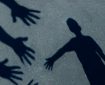 child's shadow on the ground reaching towards several outstretched hands
