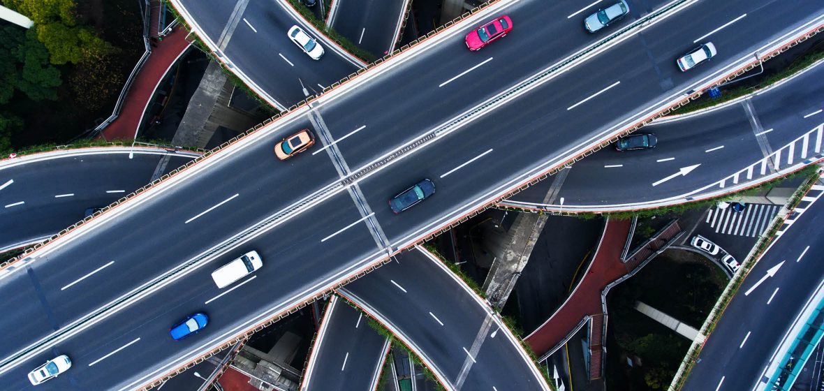 overhead view of intersecting motorways with cars