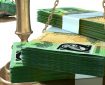 Stacks of Australian $100 notes on a scale