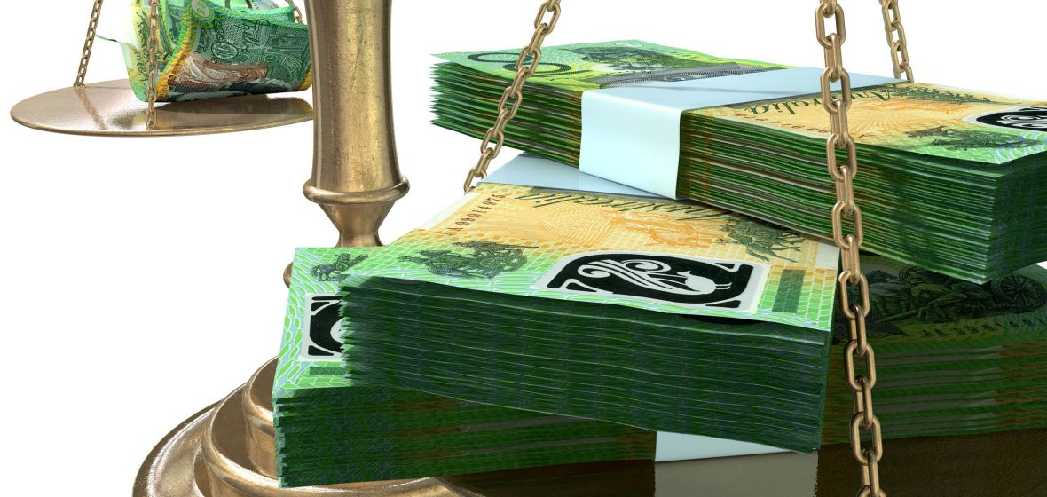 Stacks of Australian $100 notes on a scale