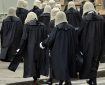 British judges wearing traditional ceremonial wigs and robes in a procession at Westminster, London