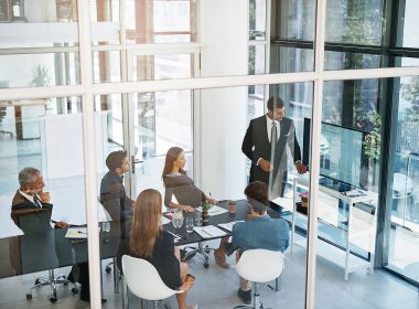 High angle shot of a young businessman giving a presentation in the boardroom