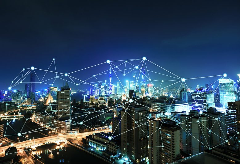 City skyline with graphic of connected lines superimposed.
