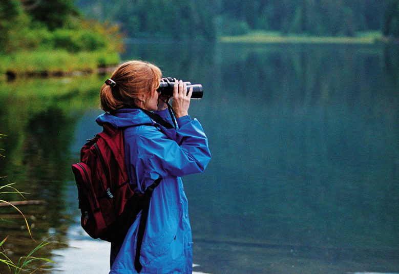 woman looking at lake in Alaska