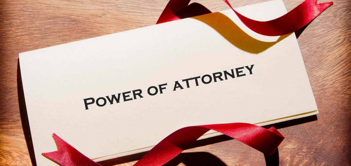Power of Attorney document with red ribbon
