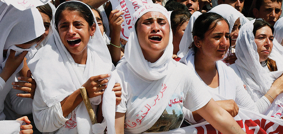 Yazidi Kurdish women chant slogans during a protest against the Islamic State in Dohuk, northern Iraq, 3 August 2015