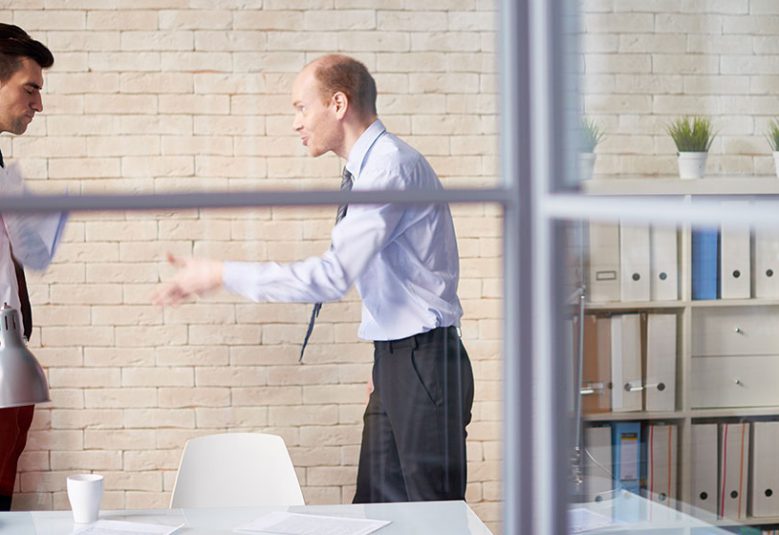 One man yelling at a colleague