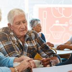 Solicitor reviews a document with an older couple