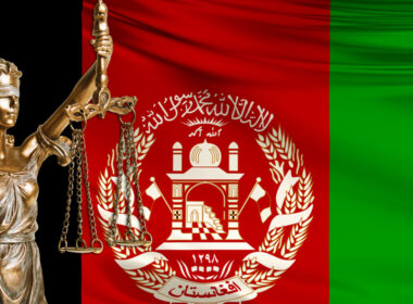 photo of Afghan flag and statue of lady justice