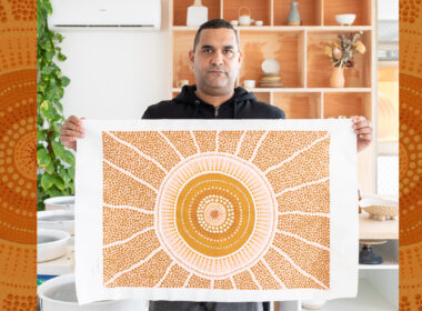 picutre of Indigenous man with art work to illustrate arts law centre work