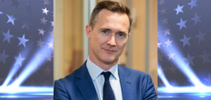 photo of media lawyer Jake Blundell with movie screen in bakcground