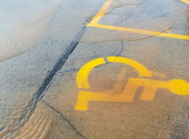 photo showing disability parking sign under floodwater